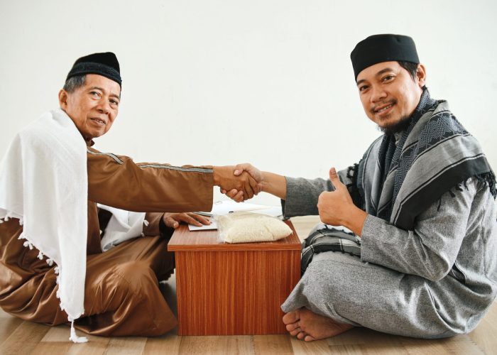muslim-man-shaking-hand-after-giving-donation-zakat-mosque-showing-thumb-up-islamic-zakat